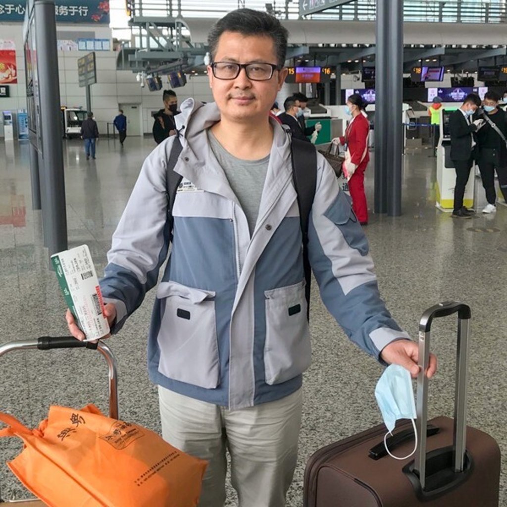 Veteran political activist Guo Feixiong is pictured with his luggages at Guangzhou Baiyun International Airport on his way to visit his wife in the US. He was detained by customs officials at Shanghai international airport. Photo: Handout
