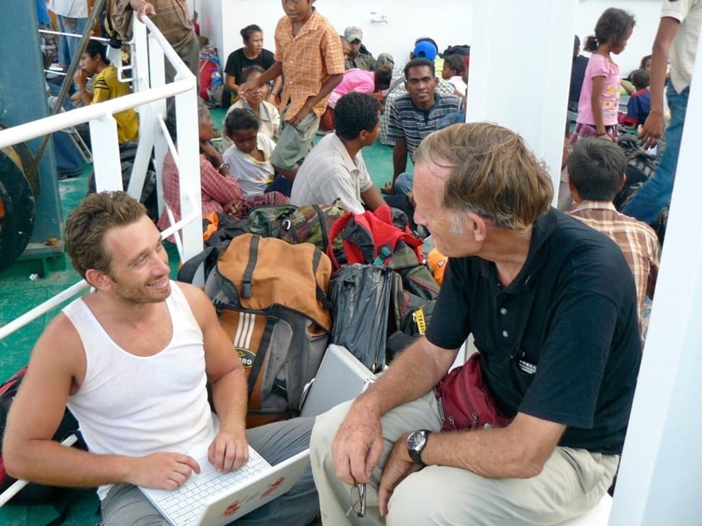 Writer Ian Lloyd Neubauer (left) interviews Daschbach in 2009 on the ferry to Oecusse. Photo: Ian Lloyd Neubauer