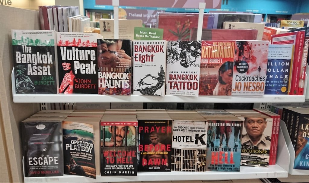 Books in a series about a Thai-American detective in Bangkok by British author John Burdett on sale at a book shop in Bangkok. Photo: Tibor Krausz