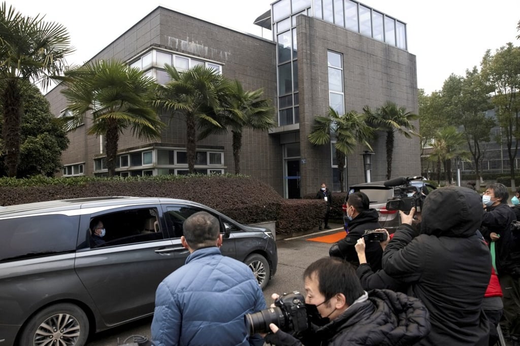 The WHO-led team arrives at the Hubei Animal Epidemic Disease Prevention and Control Centre in Wuhan, Hubei province, on Tuesday. Photo: Reuters The WHO-led team arrives at the Hubei Animal Epidemic Disease Prevention and Control Centre in Wuhan, Hubei province, on Tuesday. Photo: Reuters