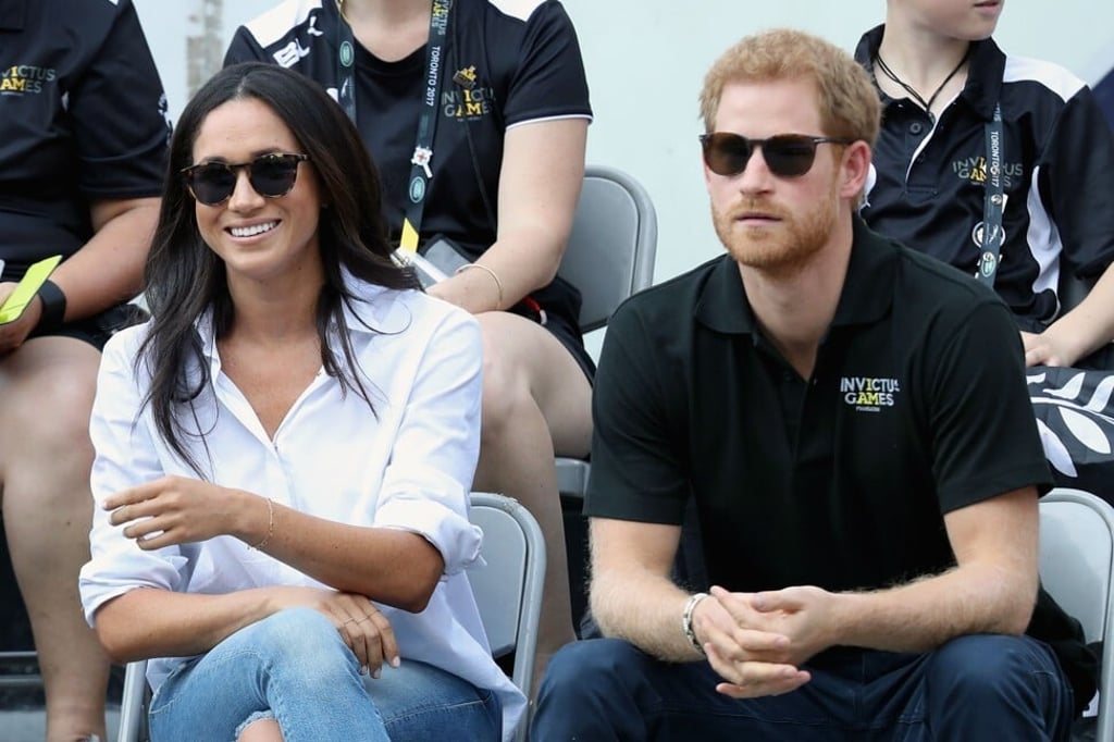 Markle wearing the Husband Shirt with Prince Harry at the Invictus Games 2017 in Toronto, Canada. Photo: AFP Markle wearing the Husband Shirt with Prince Harry at the Invictus Games 2017 in Toronto, Canada. Photo: AFP