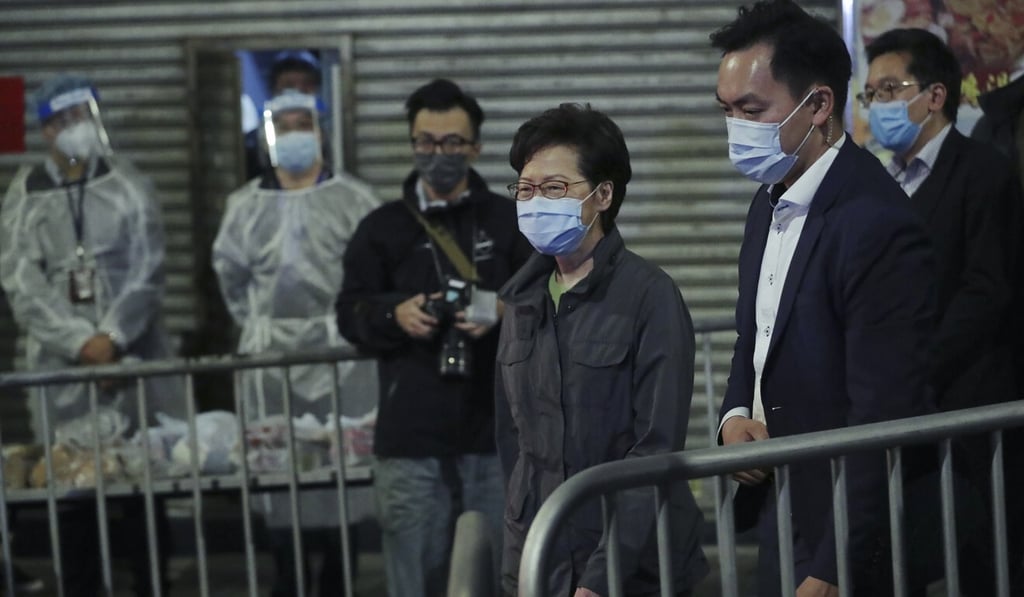 Carrie Lam on a recent visit to a locked-down area. Photo: Bloomberg