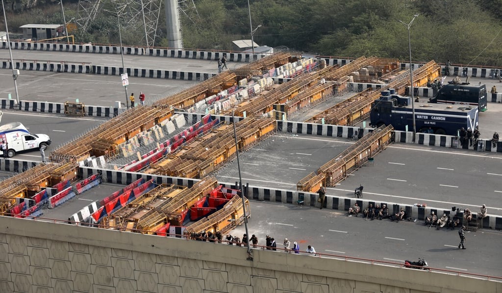 Barbed wire and barricades placed by security personnel are seen at the Delhi-Ghazipur Border on Tuesday. Photo: EPA Barbed wire and barricades placed by security personnel are seen at the Delhi-Ghazipur Border on Tuesday. Photo: EPA