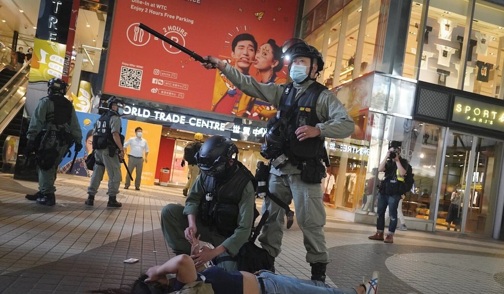 Police officers and their families became doxxing victims during the Hong Kong protests. Photo: AP Police officers and their families became doxxing victims during the Hong Kong protests. Photo: AP