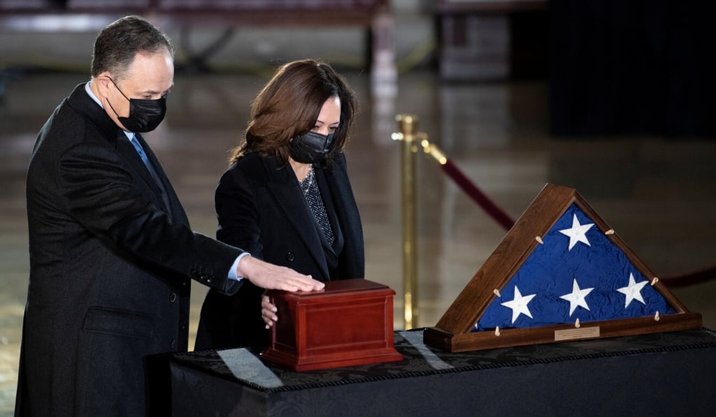 US Vice-President Kamala Harris and Second Gentleman Doug Emhoff pay their respects to US Capitol Police officer Brian D. Sicknick. Photo: Reuters