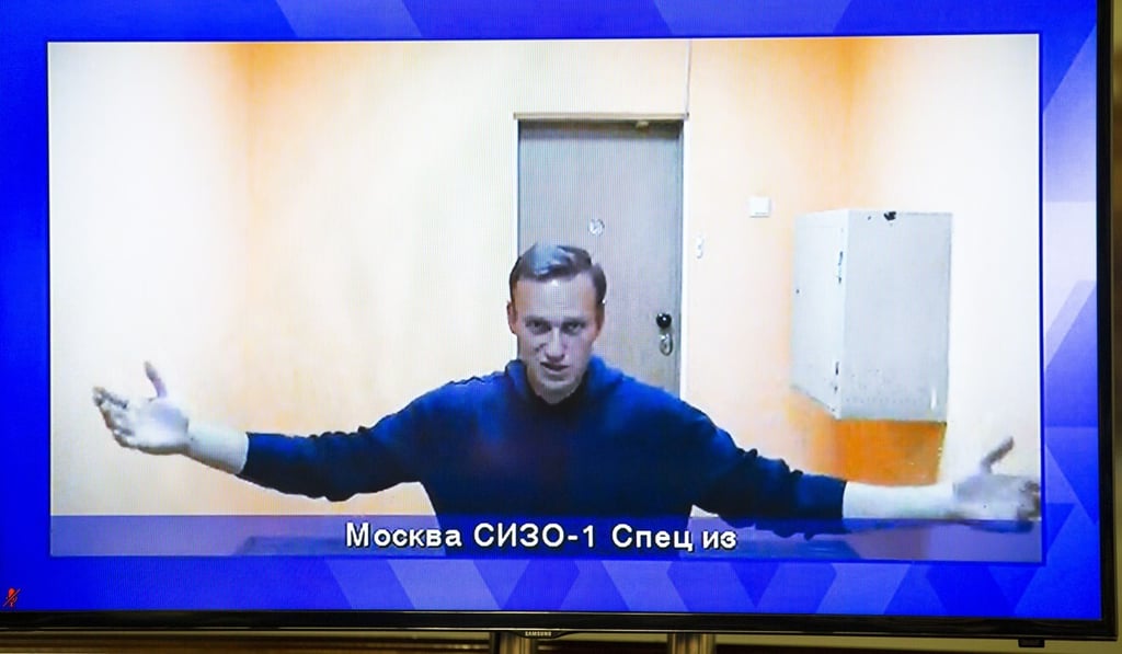 The alleged poisoning of now-jailed Russian opposition leader Alexei Navalny, shown on TV during an appeal hearing, is among issues dividing the Biden administration and the Kremlin. Photo: AP