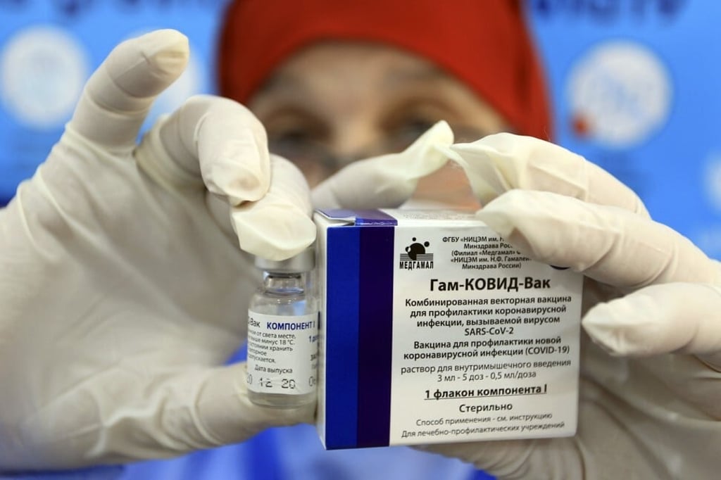 A nurse holds up Russia’s Sputnik V Covid-19 vaccine. Photo: AP