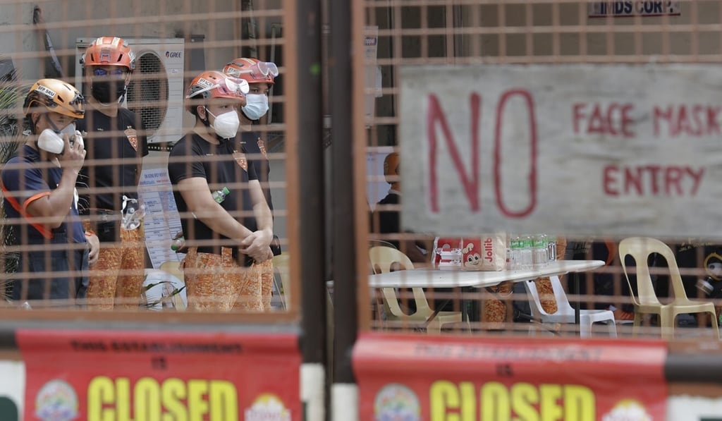 Rescuers seen at the compound of the TP Marcelo Ice Plant on February 4, 2021. Photo: AP
