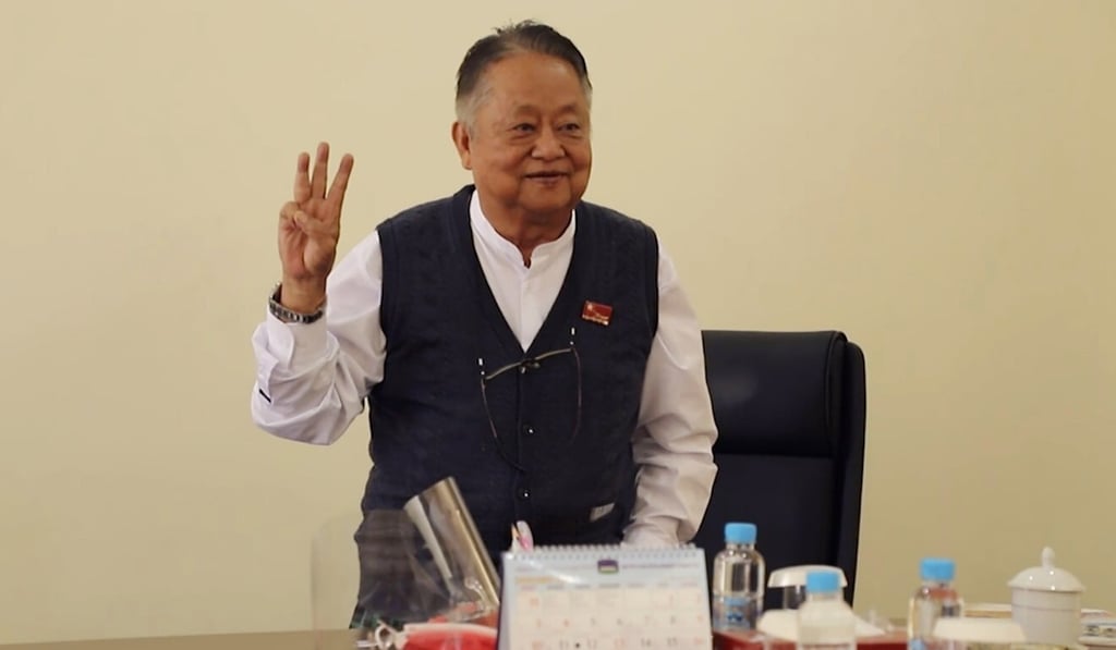 Win Htein flashes the three-finger protest gesture as a symbol of defiance in Naypyitaw earlier this week. Photo: AP