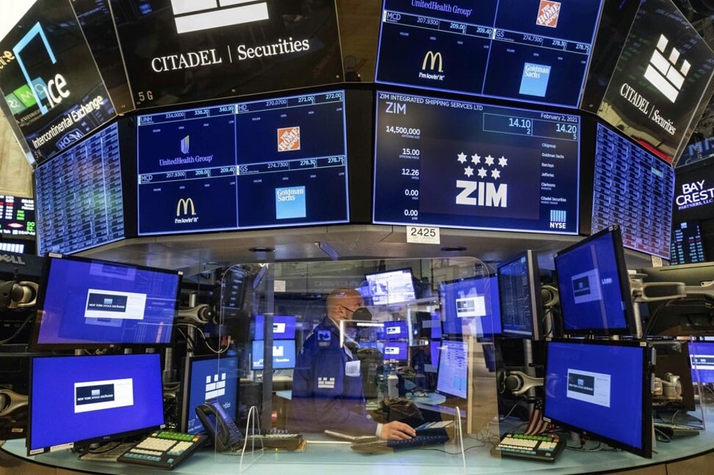 Specialist Meric Greenbaum works at a post on the floor of the New York Stock Exchange. Fake news and trolling have finally hit the financial markets. Photo: New York Stock Exchange via AP Specialist Meric Greenbaum works at a post on the floor of the New York Stock Exchange. Fake news and trolling have finally hit the financial markets. Photo: New York Stock Exchange via AP