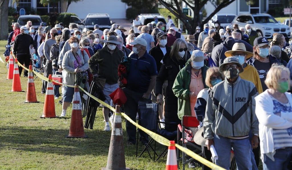 People wait in line to receive a Covid-19 vaccine in Cape Coral, Florida, USA. Photo: AP People wait in line to receive a Covid-19 vaccine in Cape Coral, Florida, USA. Photo: AP