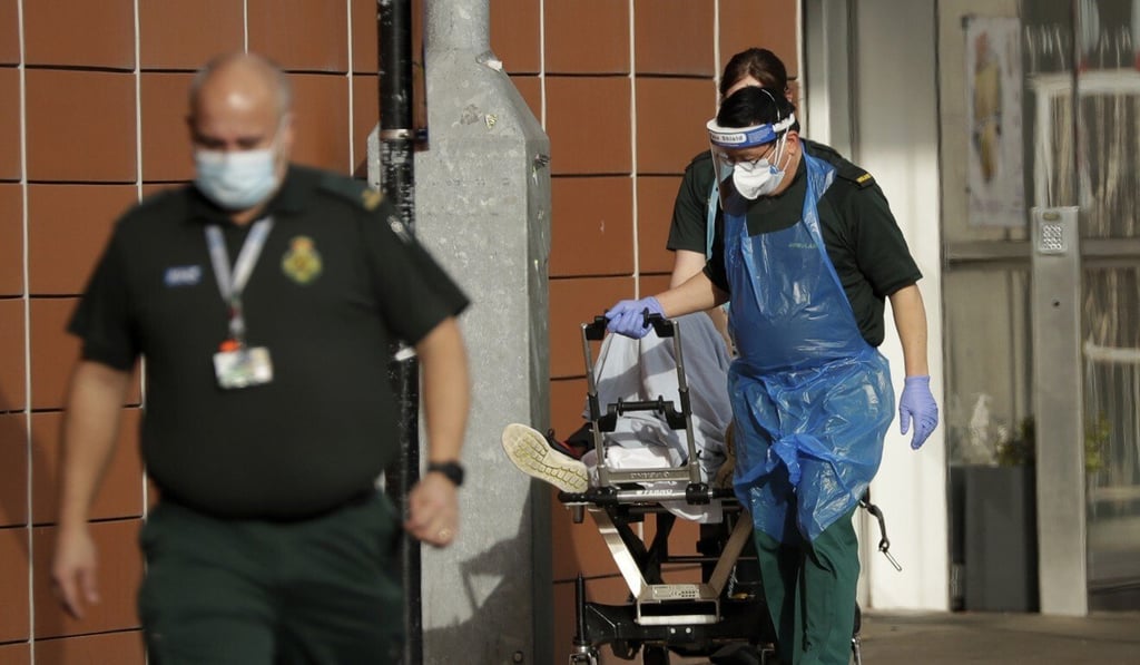 A patient is wheeled into a hospital in London on Thursday. Photo: AP A patient is wheeled into a hospital in London on Thursday. Photo: AP