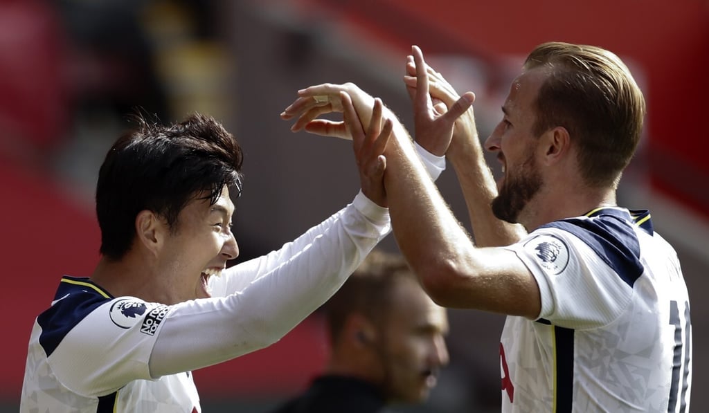 Son celebrates with teammate Harry Kane after scoring his third goal during the English Premier League match win over Southampton in September 2020. Photo: EPA