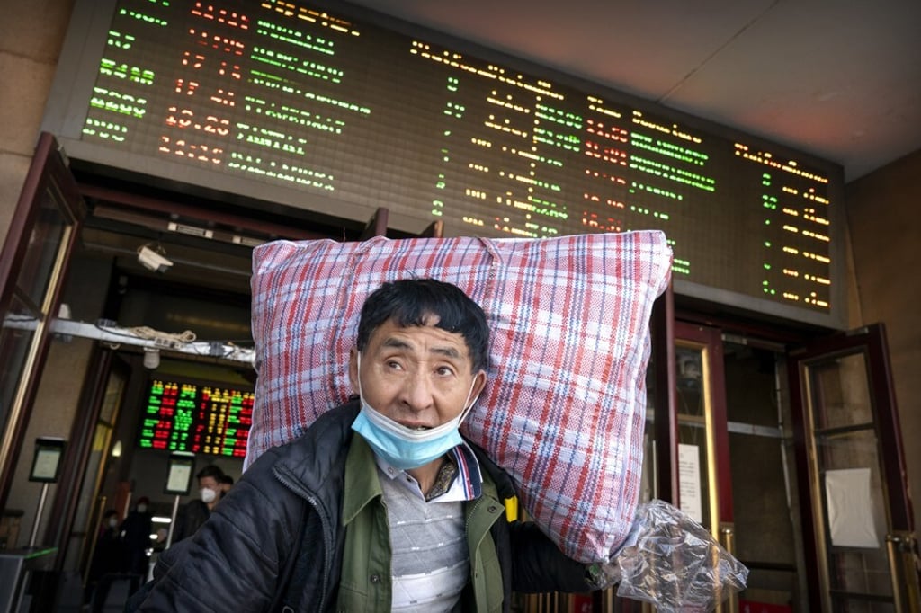 A traveller leaves Beijing railway station on January 28. Photo: AP