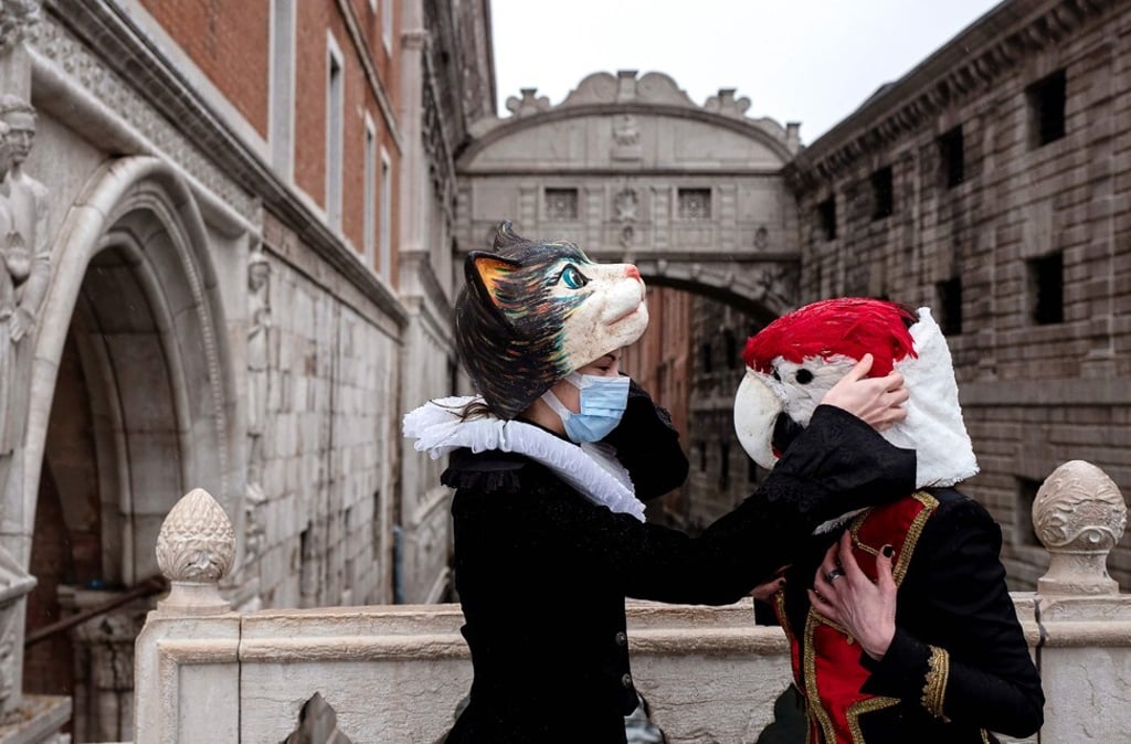Artisans by the Bridge of Sighs at St Mark's square in Venice on Sunday. Photo: AFP