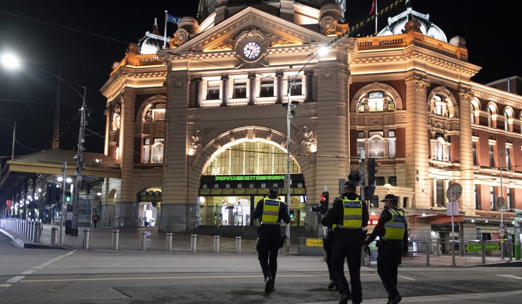 Police are seen in front of Flinders Street Station during a curfew in Melbourne on August 8, 2020. File photo: AAP Police are seen in front of Flinders Street Station during a curfew in Melbourne on August 8, 2020. File photo: AAP