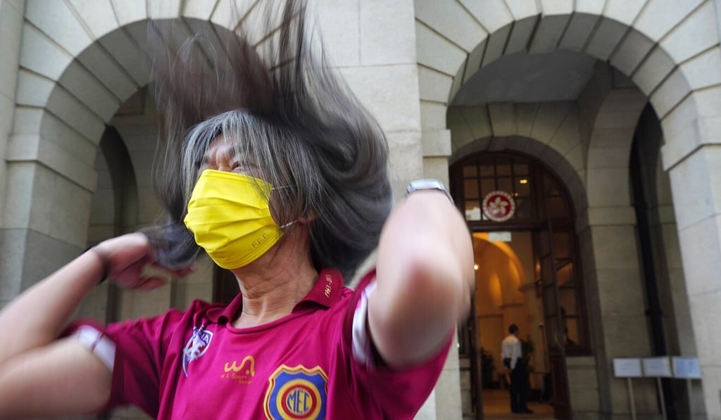 “Long Hair” Leung Kwok-hung flips his signature hair outside the Court of Final Appeal after winning against the Correctional Services Department in November. Photo: Handout “Long Hair” Leung Kwok-hung flips his signature hair outside the Court of Final Appeal after winning against the Correctional Services Department in November. Photo: Handout
