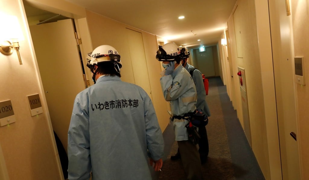 Ambulance crew members stand at a hotel corridor following a strong earthquake in Iwaki, Fukushima. Photo: Reuters Ambulance crew members stand at a hotel corridor following a strong earthquake in Iwaki, Fukushima. Photo: Reuters