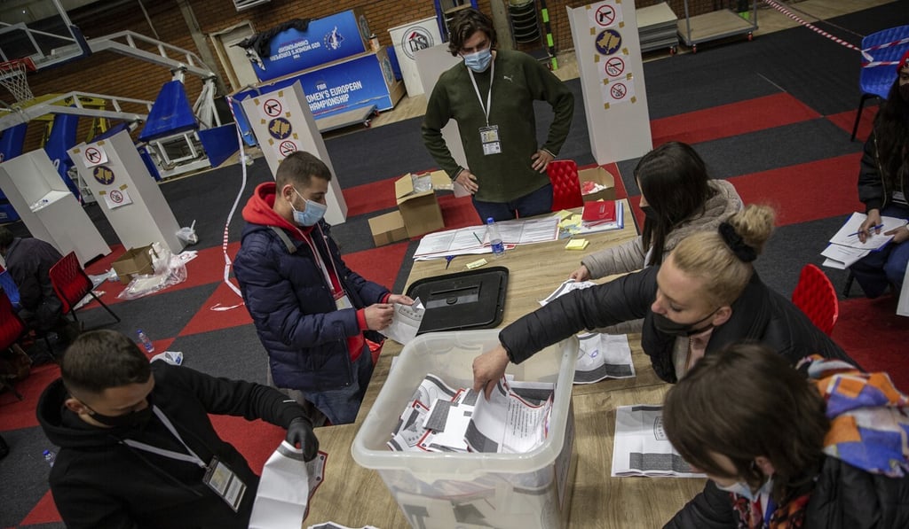 Election commission employees count ballots after polls close in Pristina, Kosovo on Sunday. Photo: AP Election commission employees count ballots after polls close in Pristina, Kosovo on Sunday. Photo: AP