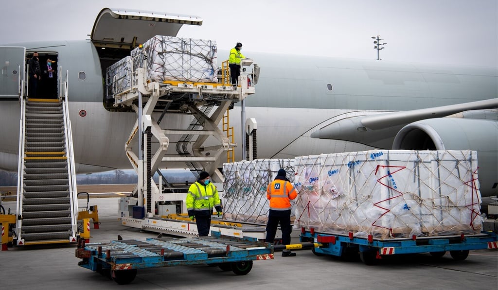 Workers unload a shipment of the Sinopharm Covid-19 vaccine as it arrives at Budapest Airport on February 16,. Photo: Ministry of Foreign Affairs and Trade (KKM) via Reuters