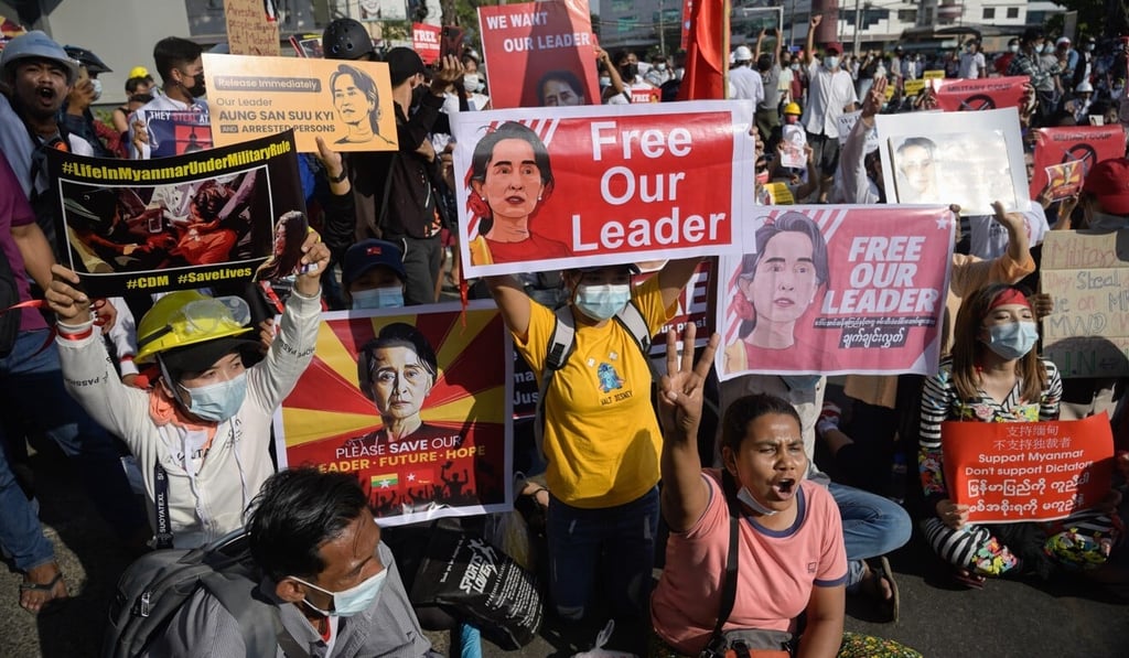 People protest against military coup near the headquarters of the National League for Democracy party in Yangon. Photo: Zuma wire/dpa