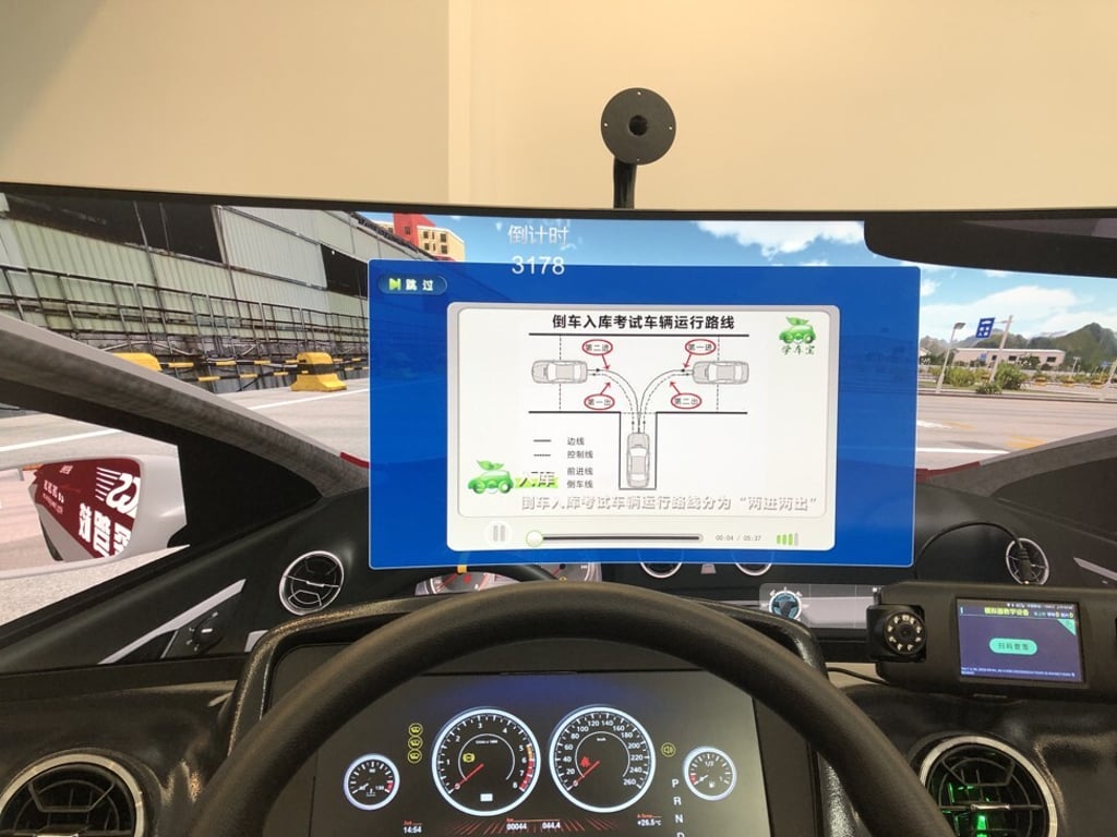 The simulators have large, curved screens that replicate the experience of driving in a test centre, complete with roads, buildings and trees. Photo: SCMP / Jane Zhang