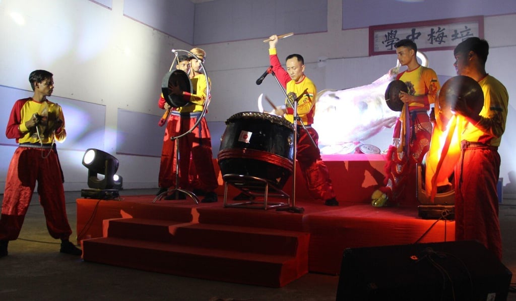 James Liao, centre, plays a Chinese drum as his students accompany him on the cymbals and a gong at a Lunar New Year celebration in Kolkata. Photo: Luo Ruiyao