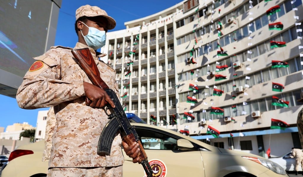 A member of the Libyan security forces secures the area on Wednesday ahead of celebrations commemorating the 10th anniversary of the 2011 revolution in Tripoli. Photo: Reuters