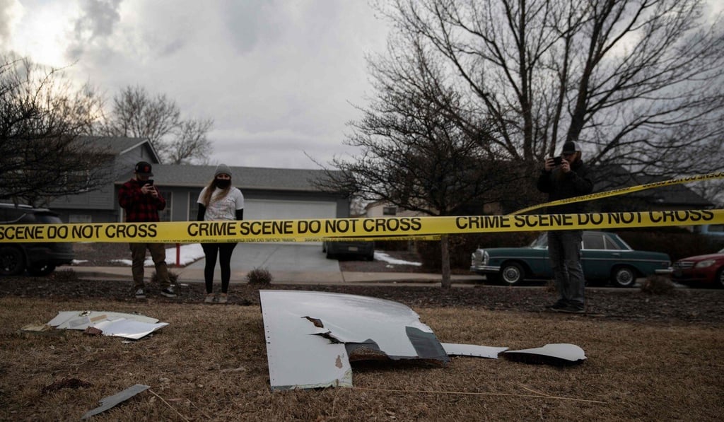 Residents take pictures of debris from the United Airlines jet’s engine failure in Broomfield, Colorado, on Saturday. Photo: AFP