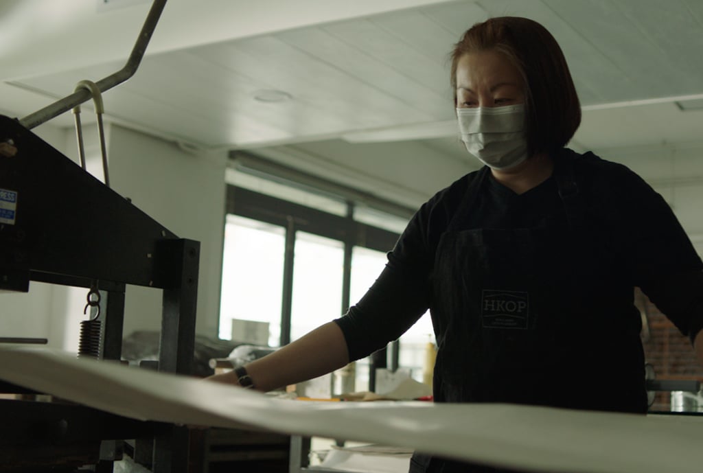 Yung Sau-mui, a lithograph artist and programme director of the Hong Kong Open Printshop, prepares to make a print. Yung Sau-mui, a lithograph artist and programme director of the Hong Kong Open Printshop, prepares to make a print.