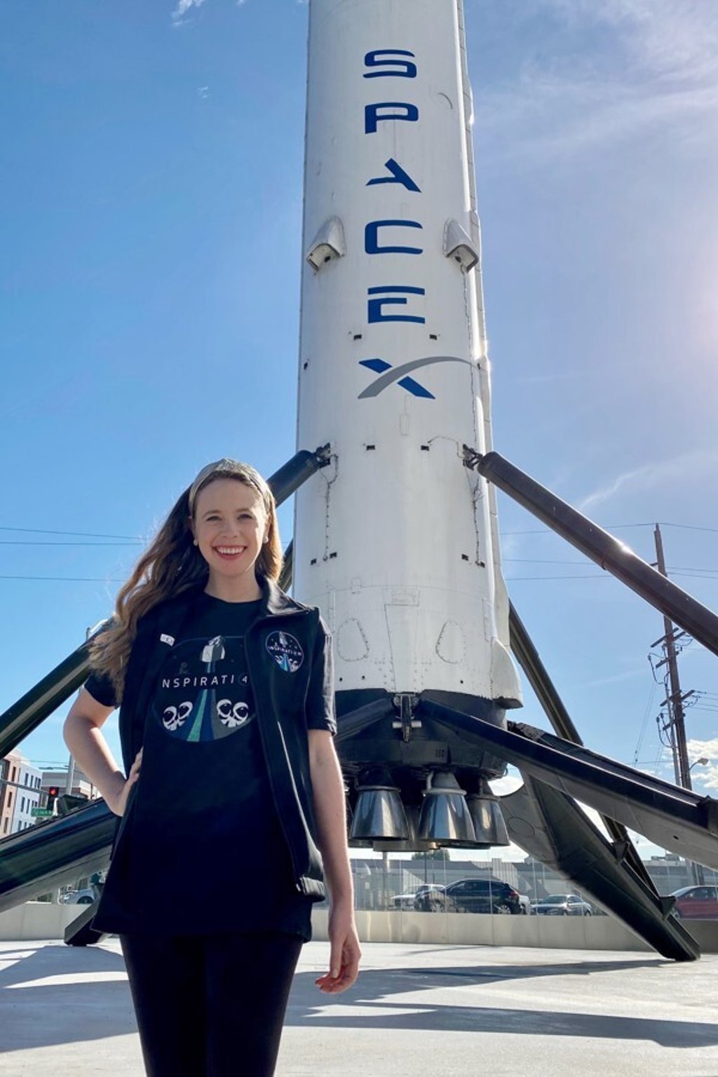 Hayley Arceneaux stands near a SpaceX rocket at the aerospace company's headquarters in California. Photo: St Jude Children’s Research Hospital via AP
