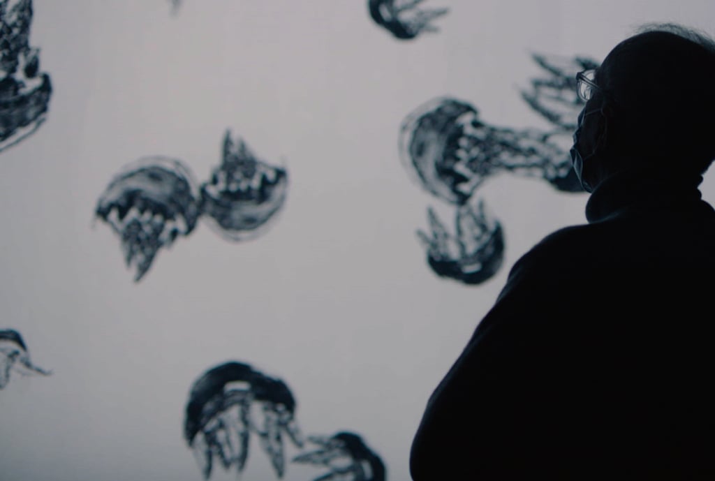 David Clarke, one of the artists taking part in the “20/20” exhibition, looks at Dancing in Water (2015), an animation work by Liu Siu-jane in which her lithography prints have been animated and set to music. Courtesy of artist collection David Clarke, one of the artists taking part in the “20/20” exhibition, looks at Dancing in Water (2015), an animation work by Liu Siu-jane in which her lithography prints have been animated and set to music. Courtesy of artist collection