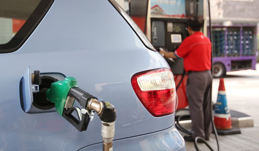Filling up a gas tank will be a lot less common in ensuing decades if a city road map towards electric vehicles is followed. Photo: Edward Wong Filling up a gas tank will be a lot less common in ensuing decades if a city road map towards electric vehicles is followed. Photo: Edward Wong