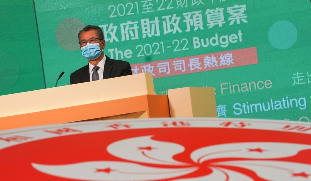 Financial Secretary Paul Chan takes part in a radio call-in show on Thursday. Photo: Felix Wong