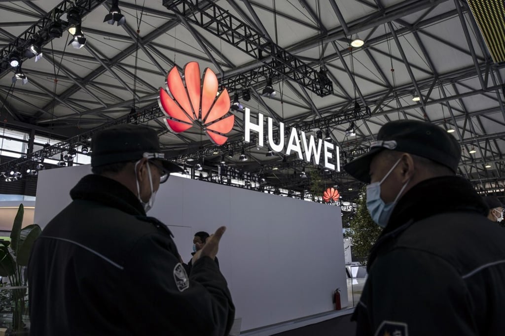 Attendees walk past the Huawei Technologies Co logo at telecommunications industry trade show MWC Shanghai on February 23, 2021. Photo: Bloomberg