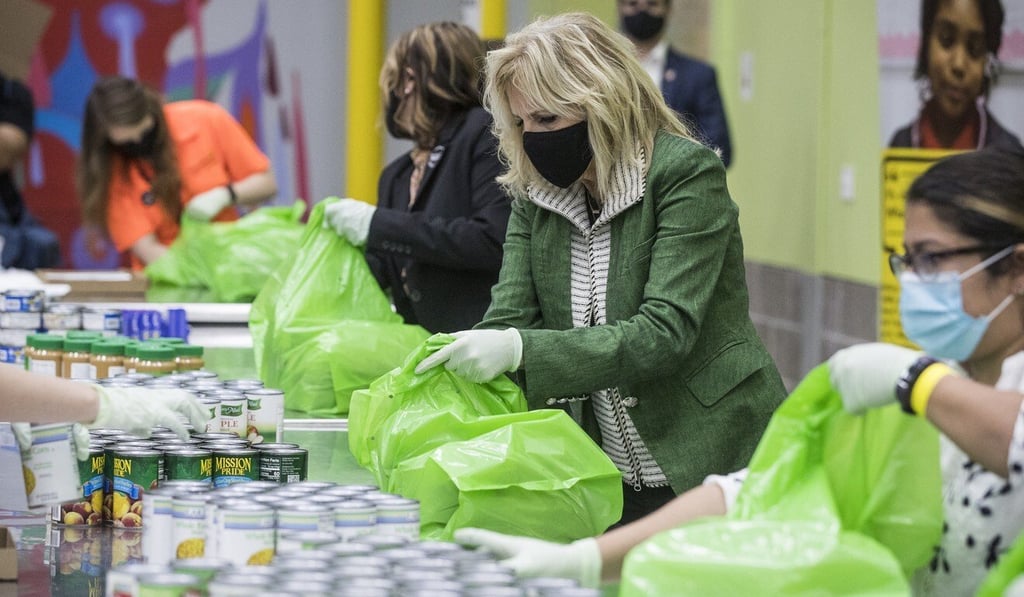 US First Lady Jill Biden helps pack a backpack buddy bag of food with volunteers at the Houston Food Bank. Photo: AP US First Lady Jill Biden helps pack a backpack buddy bag of food with volunteers at the Houston Food Bank. Photo: AP