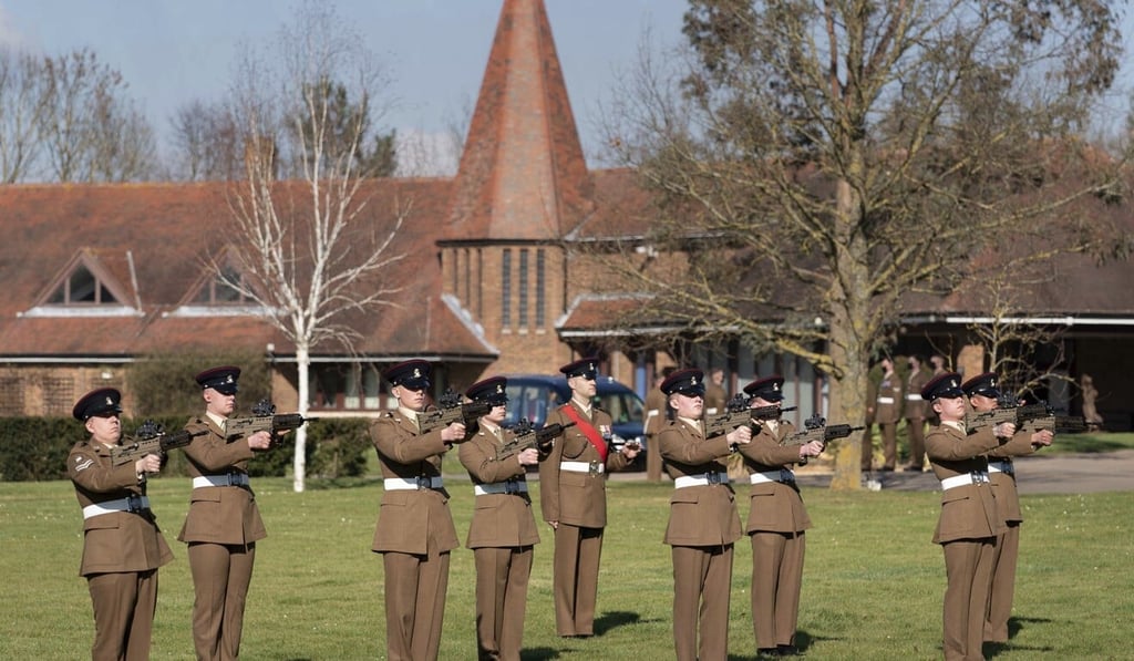 A three-round gun salute by the British soldiers at the funeral of Captain Tom Moore in Bedford. Photo: AP A three-round gun salute by the British soldiers at the funeral of Captain Tom Moore in Bedford. Photo: AP