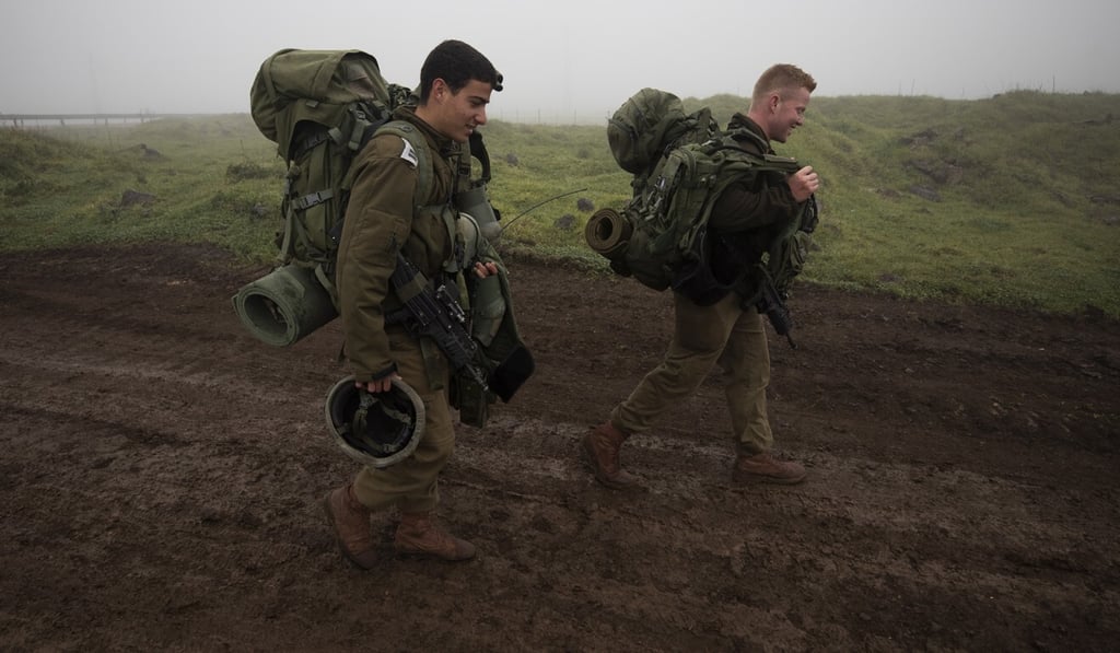 Israeli soldiers arrive at a gathering site in the Golan Heights. Photo: EPA-EFE Israeli soldiers arrive at a gathering site in the Golan Heights. Photo: EPA-EFE