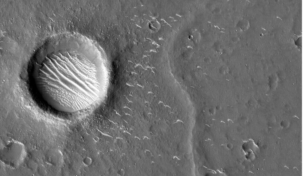 An image of Mars taken by China’s Tianwen-1 shows fine ridges on the bottom of a crater. Photo: Reuters/CNSA