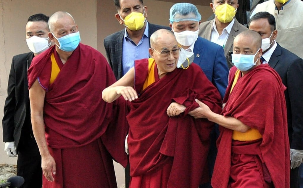 The Dalai Lama, centre, departing the hospital after receiving his first Covid-19 shot. Photo: EPA-EFE The Dalai Lama, centre, departing the hospital after receiving his first Covid-19 shot. Photo: EPA-EFE