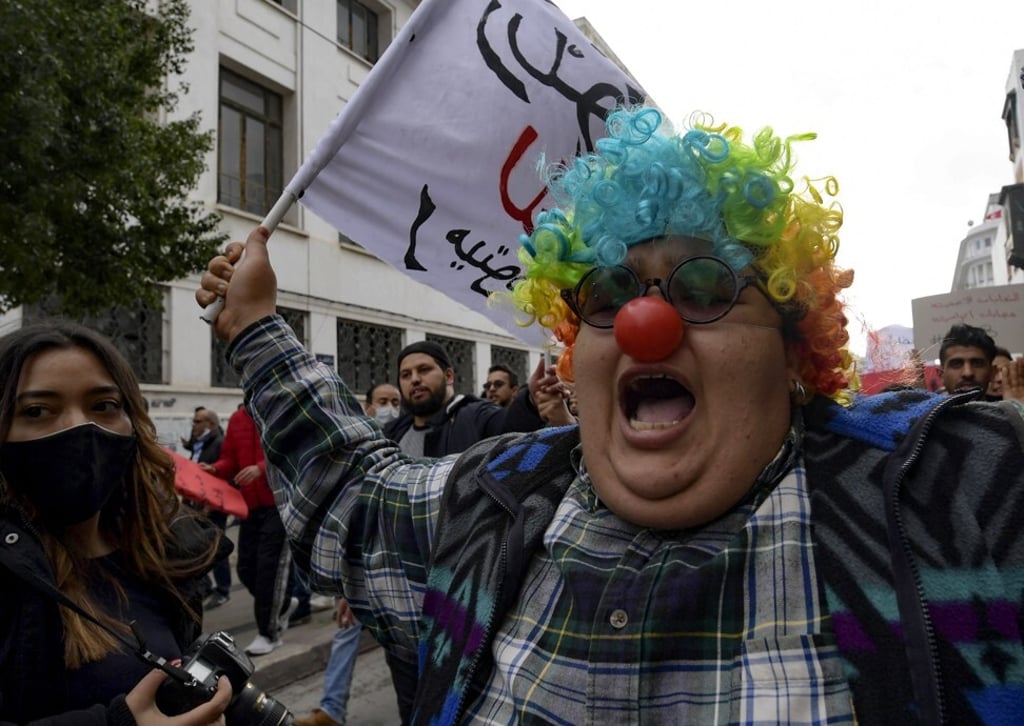 Tunisian feminist activist Rania Amdouni, dressed as a clown, at an anti-government demonstration in Tunis in January. Photo: AFP Tunisian feminist activist Rania Amdouni, dressed as a clown, at an anti-government demonstration in Tunis in January. Photo: AFP
