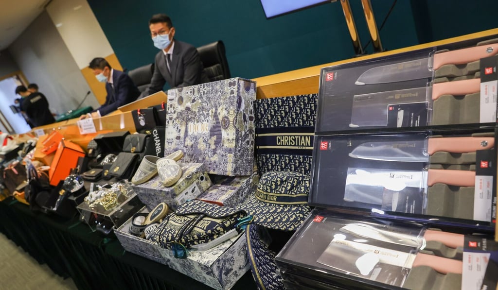 The Customs and Excise Department displays some of the counterfeit luxury goods seized during its crackdown. Photo: Nora Tam