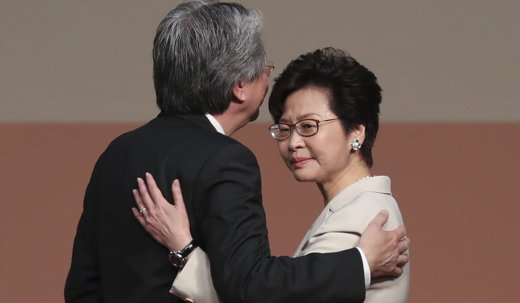 Former Hong Kong finance chief John Tsang and current Chief Executive Carrie Lam embrace as election results were announced in 2017. Photo: Robert Ng Former Hong Kong finance chief John Tsang and current Chief Executive Carrie Lam embrace as election results were announced in 2017. Photo: Robert Ng