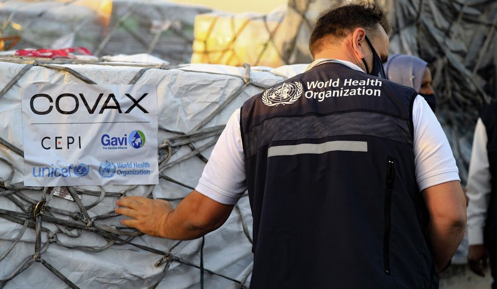 An employee of the World Health Organization supervises the arrival of the first batch of coronavirus vaccines in Sudan, as part of the Covax Facility. Photo: AFP An employee of the World Health Organization supervises the arrival of the first batch of coronavirus vaccines in Sudan, as part of the Covax Facility. Photo: AFP