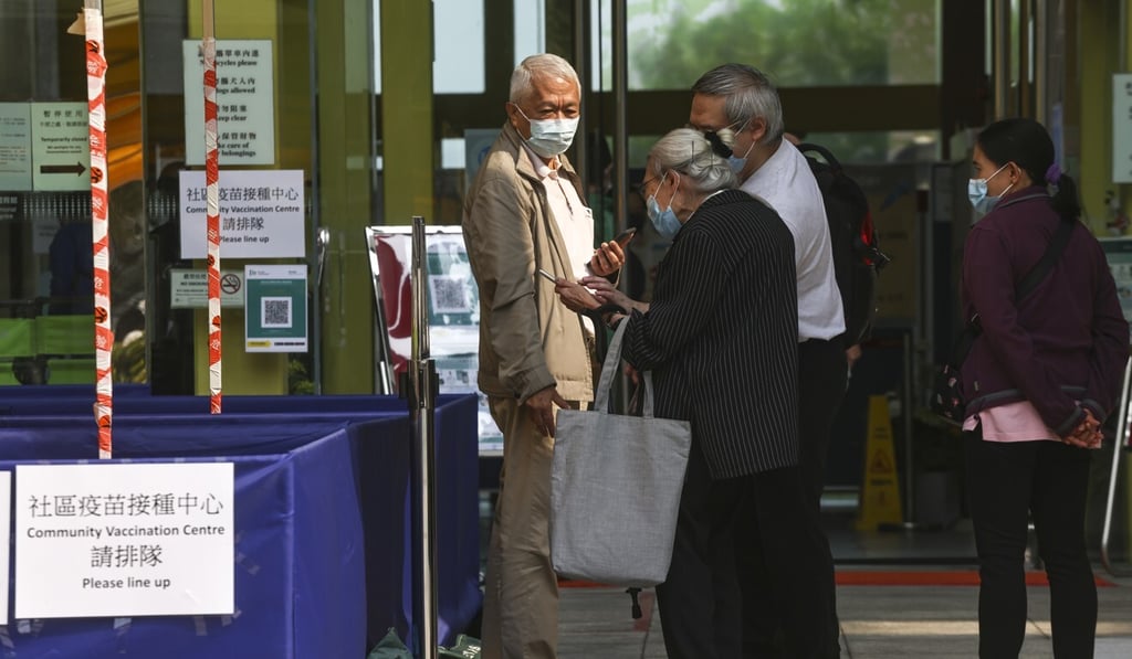 People leave a community vaccination centre in Sai Ying Pun after receiving Pfizer-BioNTech coronavirus jabs. Photo: K. Y. Cheng