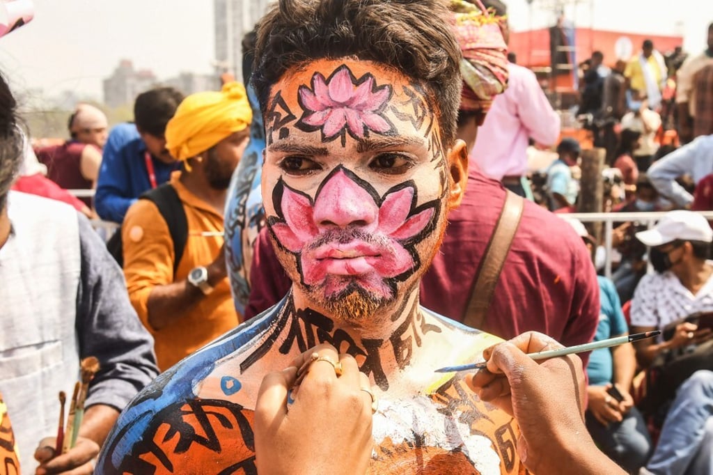 A Bharatiya Janata Party (BJP) supporter gets his body painted during a mass rally in Kolkata featuring Prime Minister Narendra Modi ahead of state legislative assembly elections. Photo: AFP