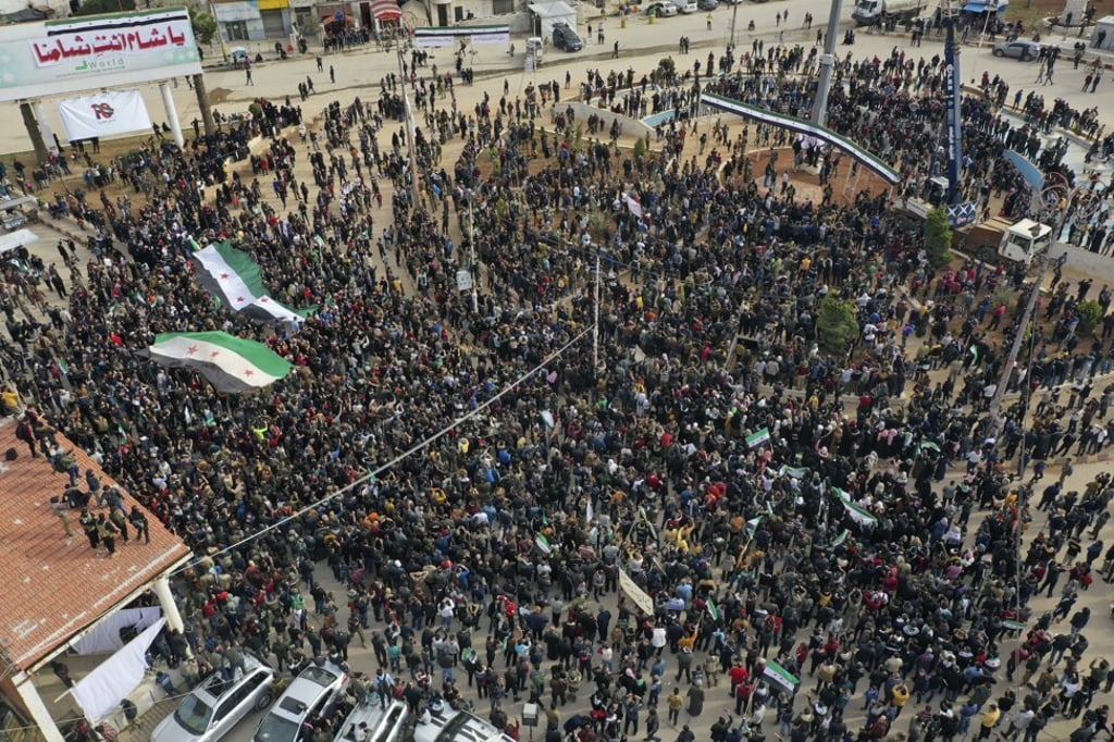 Thousands of anti-Syrian government protesters mark 10 years since the start of a popular uprising against President Bashar al-Assad's rule on Monday. Photo: AP Thousands of anti-Syrian government protesters mark 10 years since the start of a popular uprising against President Bashar al-Assad's rule on Monday. Photo: AP