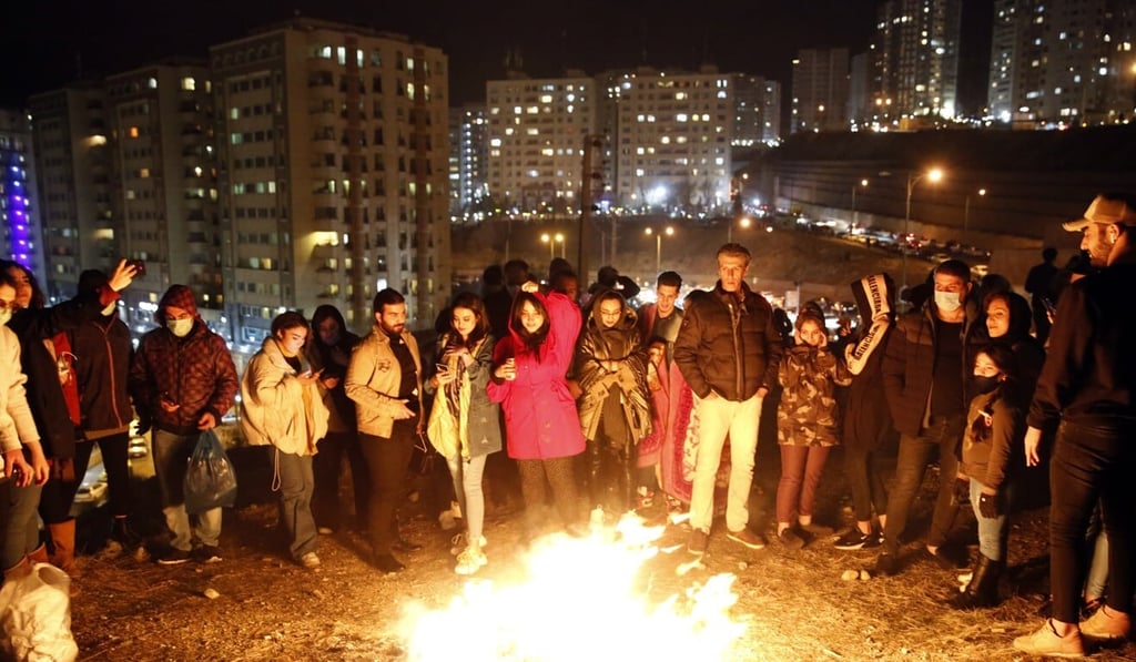 Iranians stand around a fire during Charshanbeh Suri celebrations in Tehran. Photo: EPA Iranians stand around a fire during Charshanbeh Suri celebrations in Tehran. Photo: EPA