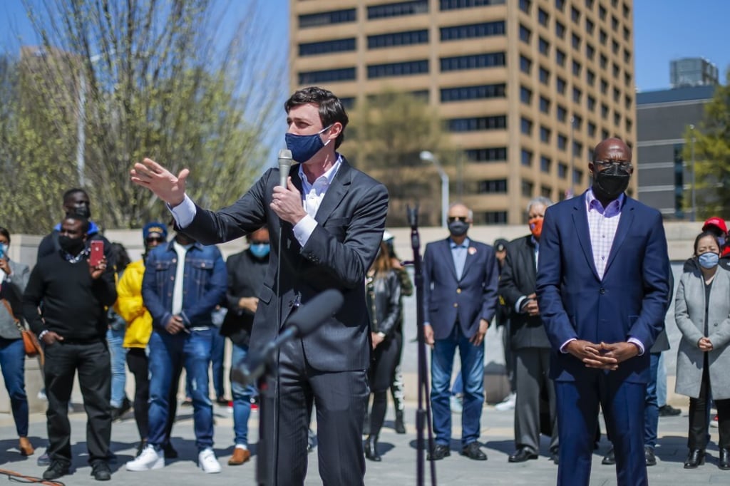 Georgia Democratic US Senators Jon Ossoff, left, and Reverend Raphael Warnock outside the State Capitol in Atlanta, Georgia on Saturday. Photo: EPA-EFE