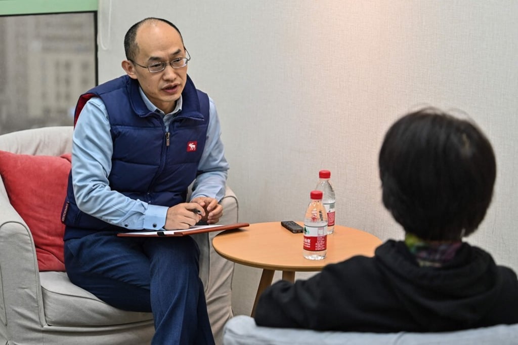 Marriage counsellor Zhu Shenyong, left, advises a client in Shanghai. Zhu has been in high demand as more Chinese couples contemplate divorce. Photo: AFP Marriage counsellor Zhu Shenyong, left, advises a client in Shanghai. Zhu has been in high demand as more Chinese couples contemplate divorce. Photo: AFP